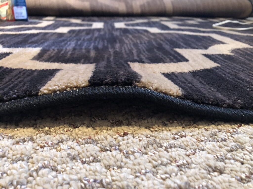 how to flatten a new rug