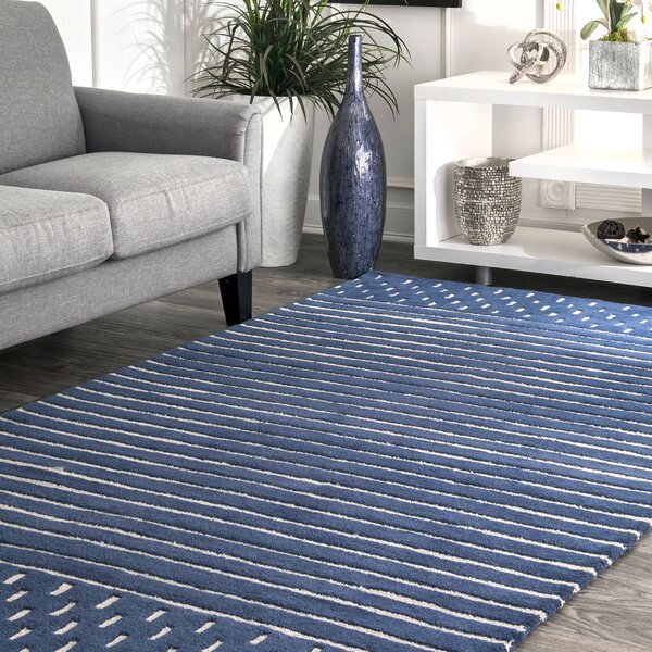navy blue rug and grey sofa